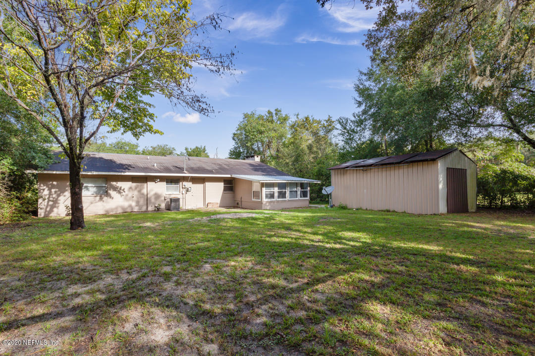 6576 Immokalee Road Keystone Heights, FL 32656 - Photo 7 of 31 a big yard with large trees