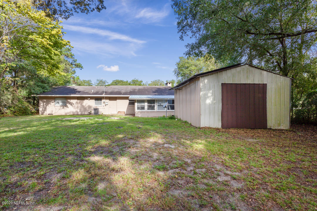 6576 Immokalee Road Keystone Heights, FL 32656 - Photo 8 of 31 a view of a house with a yard
