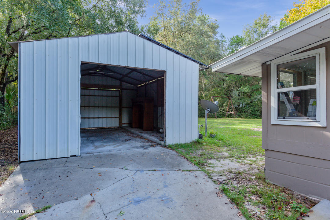 6576 Immokalee Road Keystone Heights, FL 32656 - Photo 10 of 31 a view of backyard with green space
