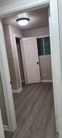 a view of a chair and table in backyard of the house