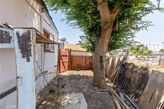 a view of a house with a tree in the background