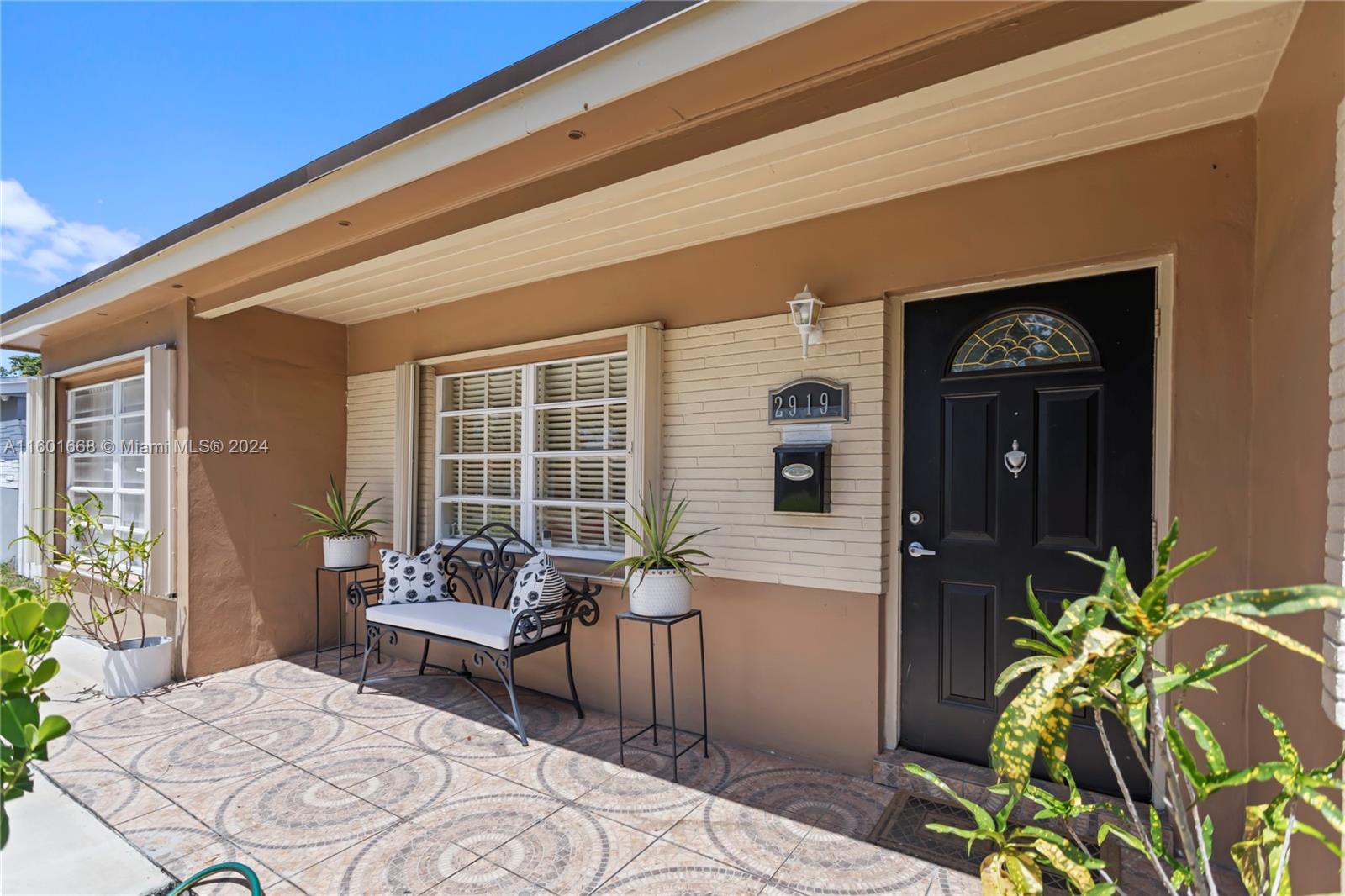 2919 Southwest 68th Avenue Miramar, FL 33023 - Photo 1 of 46 a balcony with furniture and potted plants