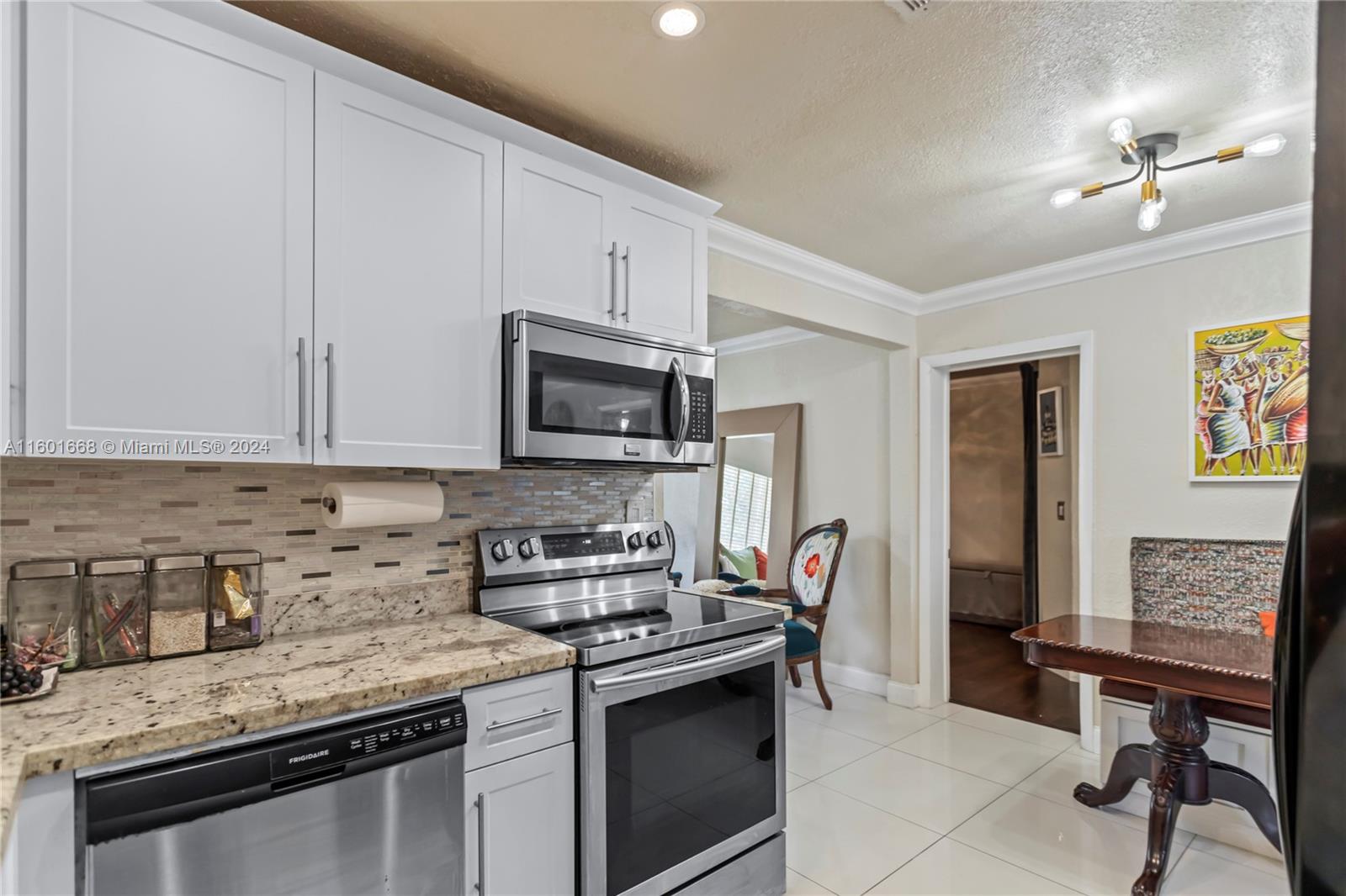 2919 Southwest 68th Avenue Miramar, FL 33023 - Photo 16 of 46 a kitchen with stainless steel appliances granite countertop a stove a sink dishwasher and a refrigerator