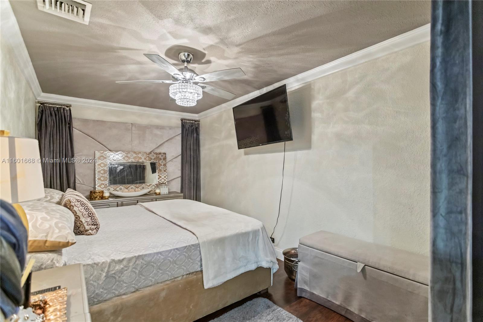 2919 Southwest 68th Avenue Miramar, FL 33023 - Photo 19 of 46 a bedroom with a bed and a flat screen tv