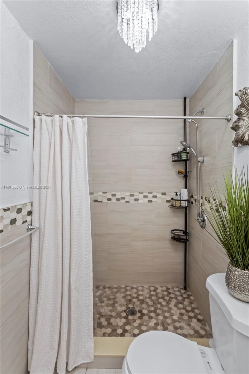 2919 Southwest 68th Avenue Miramar, FL 33023 - Photo 22 of 46 a bathroom with a toilet and a shower