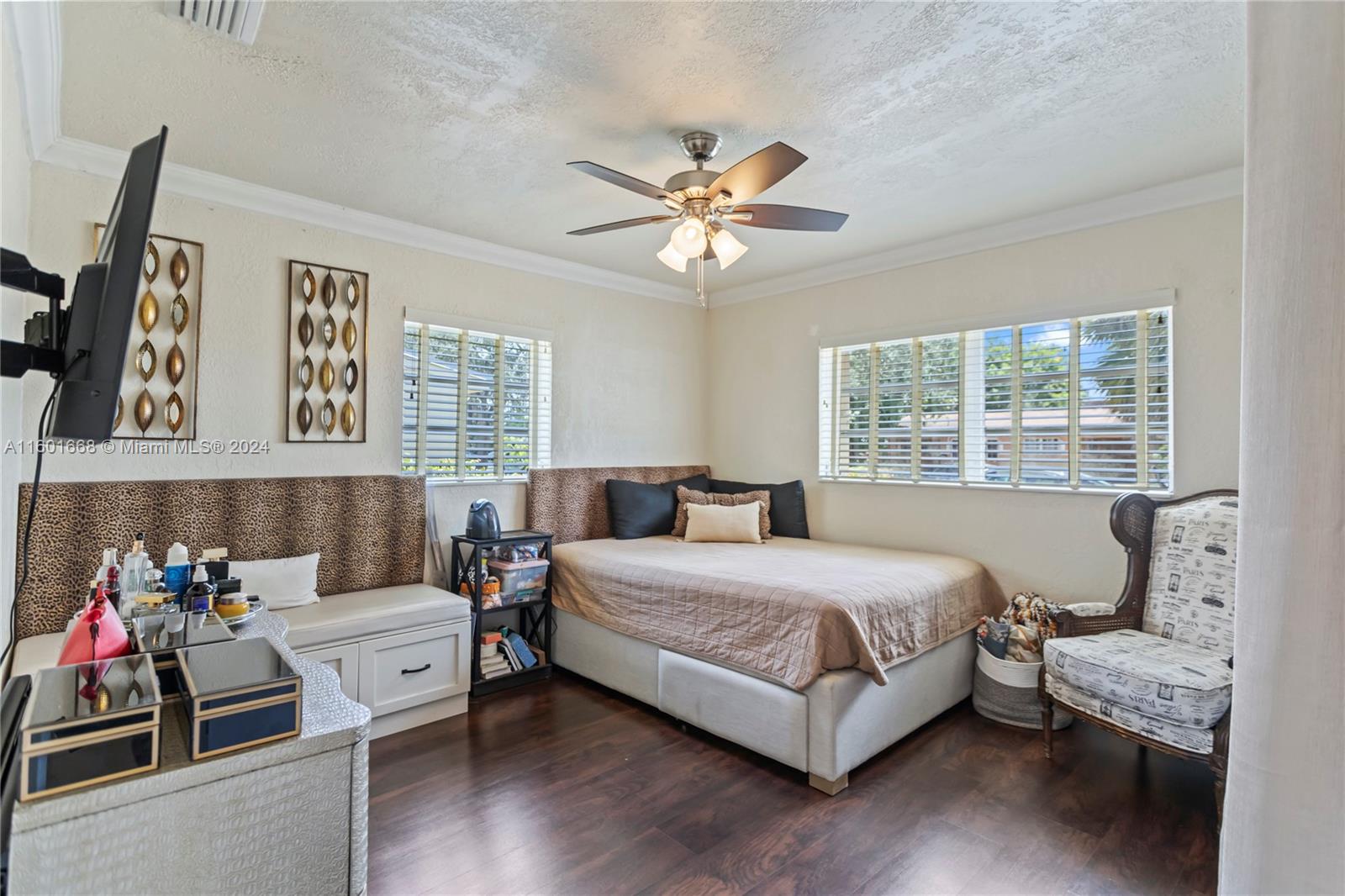 2919 Southwest 68th Avenue Miramar, FL 33023 - Photo 27 of 46 a bedroom with a bed and a chandelier