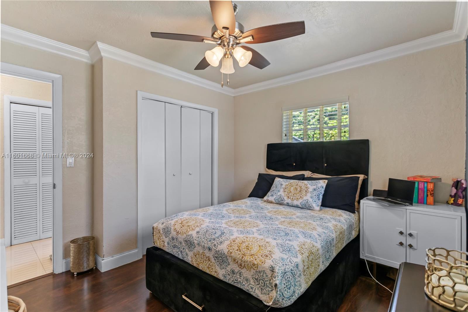 2919 Southwest 68th Avenue Miramar, FL 33023 - Photo 34 of 46 a bedroom with a bed and a chandelier