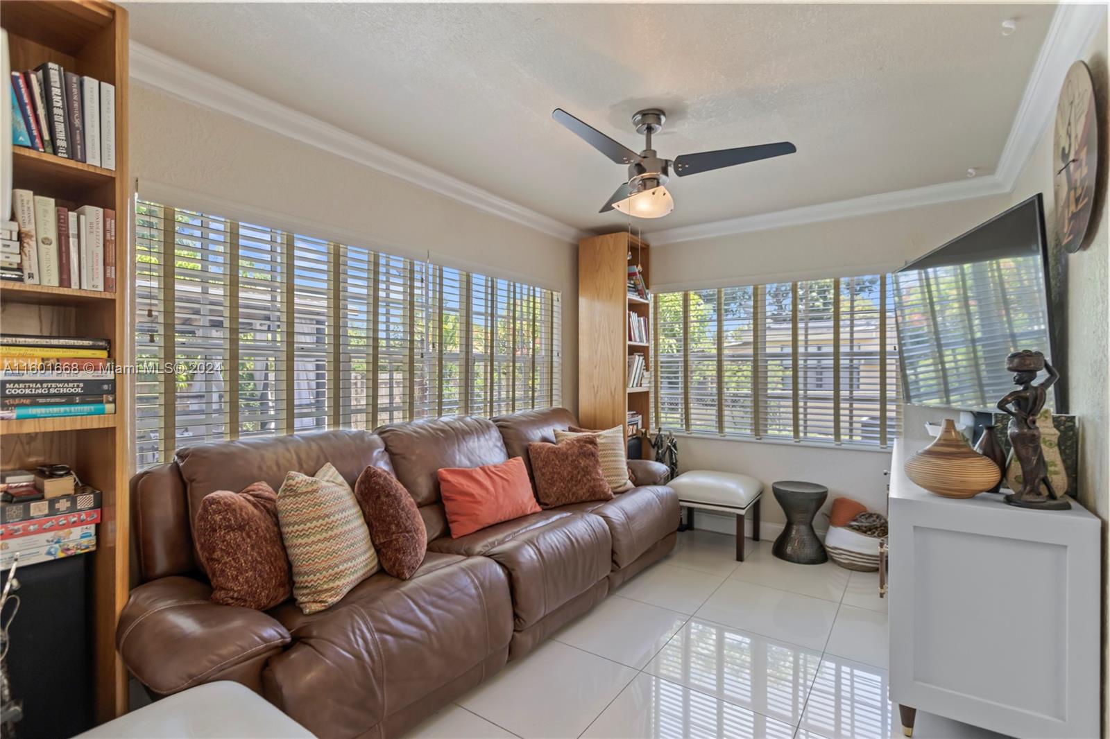 2919 Southwest 68th Avenue Miramar, FL 33023 - Photo 35 of 46 a living room with furniture and a large window