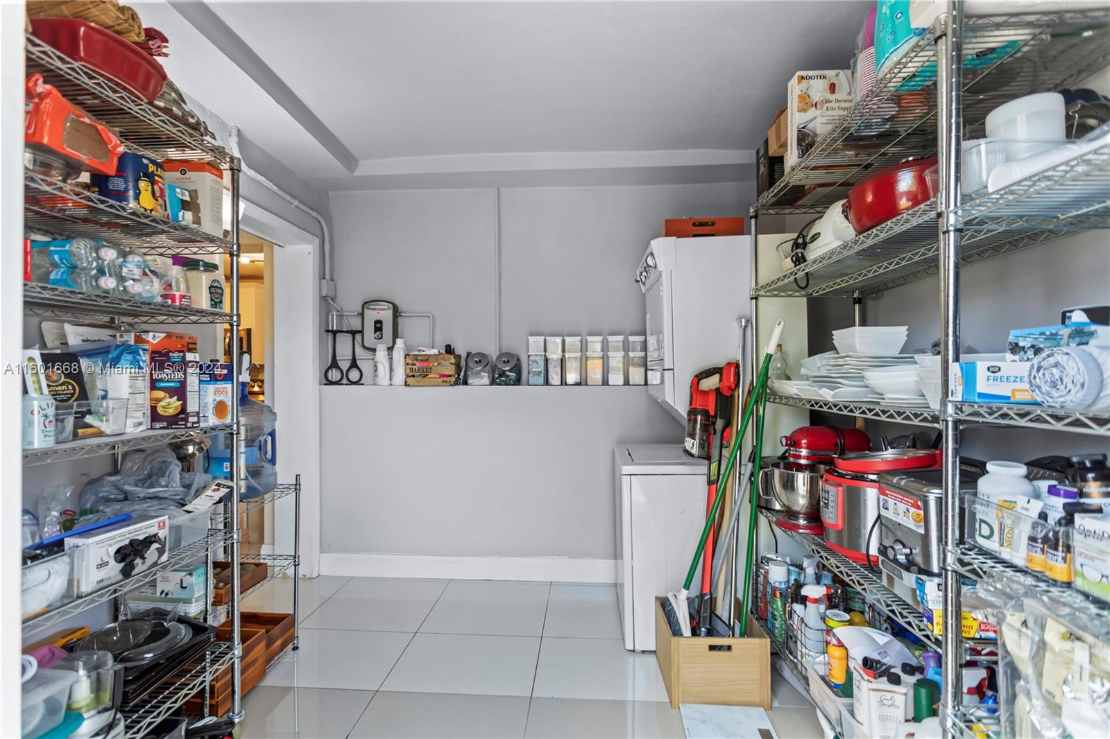 2919 Southwest 68th Avenue Miramar, FL 33023 - Photo 41 of 46 a utility room with fridge and toys
