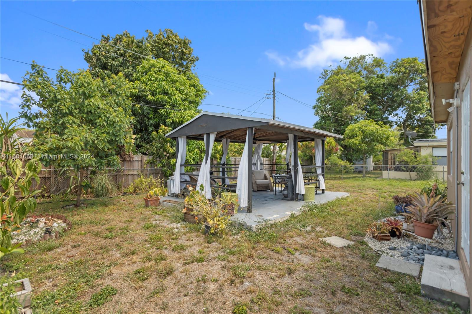 2919 Southwest 68th Avenue Miramar, FL 33023 - Photo 42 of 46 a view of a house with backyard porch and sitting area