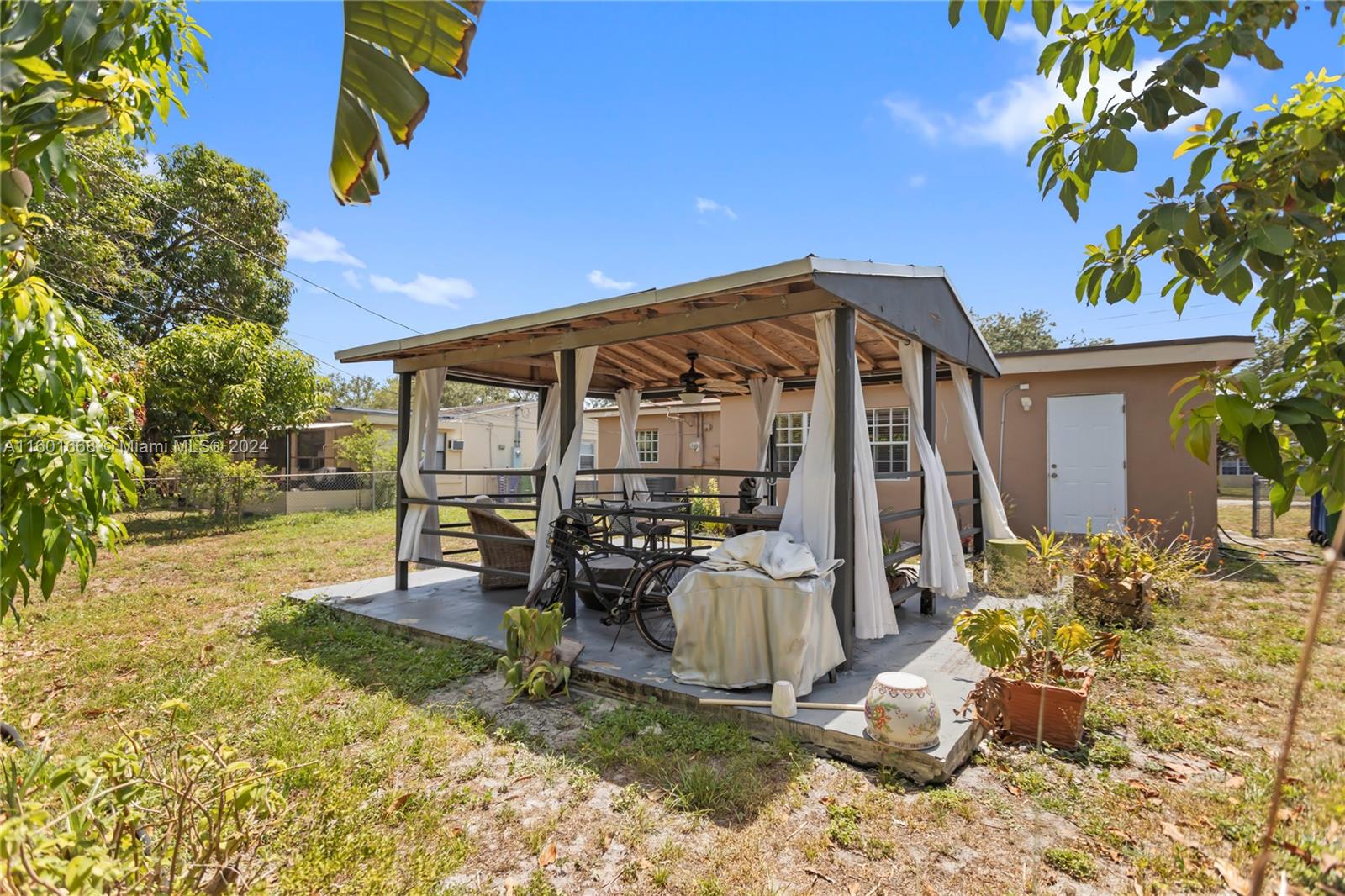 2919 Southwest 68th Avenue Miramar, FL 33023 - Photo 43 of 46 a front view of a house with patio