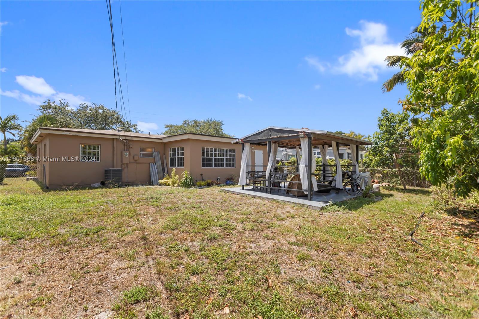 2919 Southwest 68th Avenue Miramar, FL 33023 - Photo 44 of 46 a view of a house with a yard