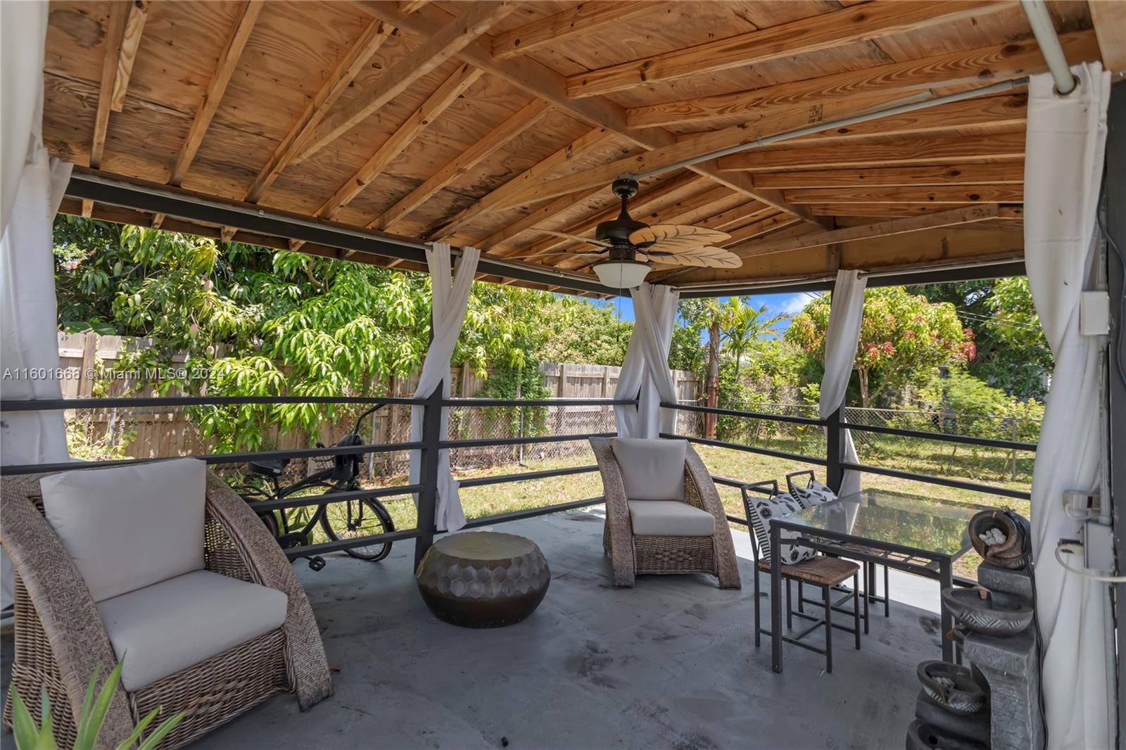 2919 Southwest 68th Avenue Miramar, FL 33023 - Photo 45 of 46 a view of a chairs and table in the patio