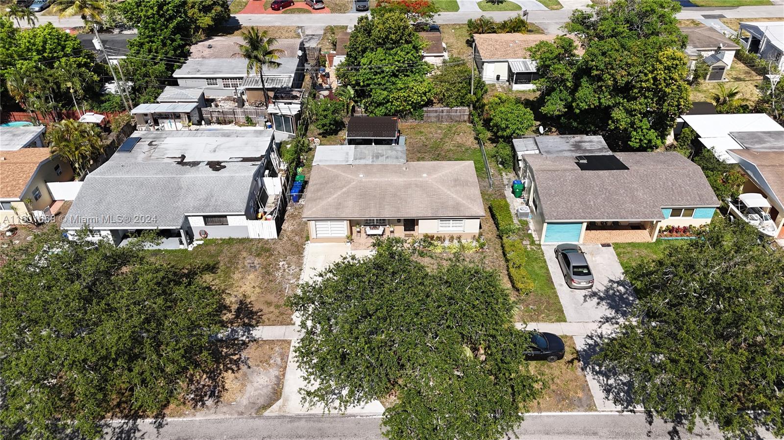 2919 Southwest 68th Avenue Miramar, FL 33023 - Photo 7 of 46 an aerial view of multiple houses with a yard