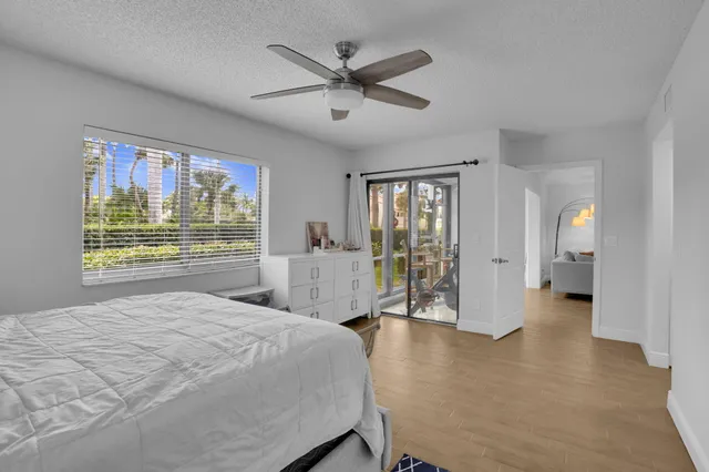 a view of a livingroom with a furniture and a ceiling fan