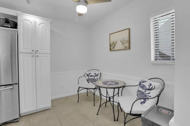 a kitchen with granite countertop a refrigerator and a sink