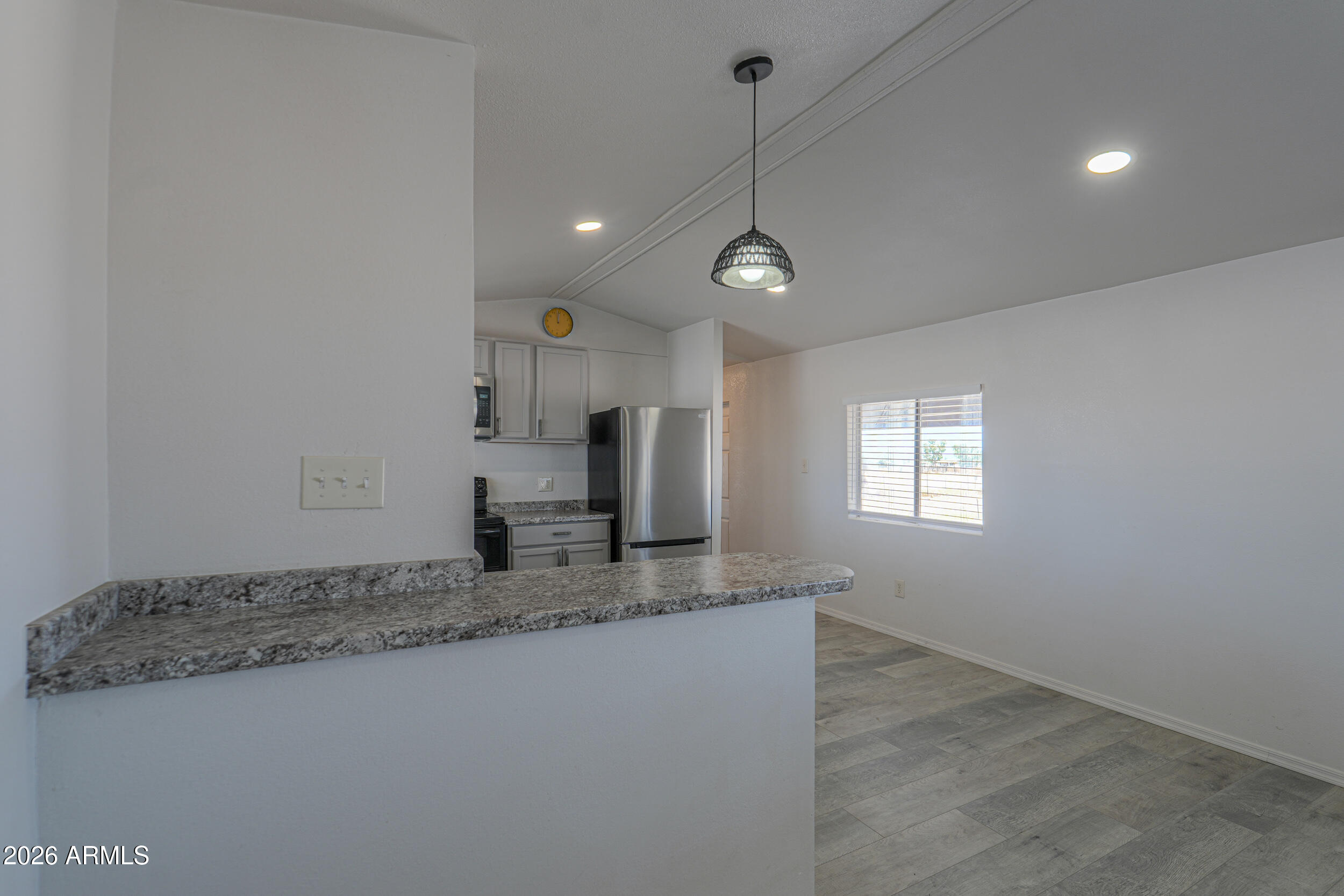 33776 West Siesta Road Stanfield, AZ 85172 - Photo 37 of 54 a view of a kitchen with a sink refrigerator and a window