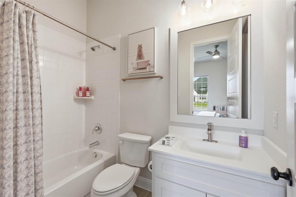11116 Emory Oak Ridge Flower Mound, TX 76226 - Photo 26 of 40 a bathroom with a sink toilet and shower