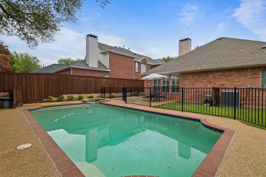14633 Heritage Lane Addison, TX 75001 - Photo 1 of 1 a view of a backyard with a patio