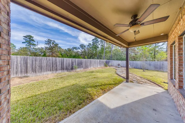 a house view with swimming pool in front of it