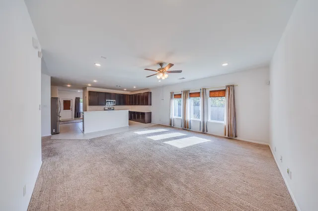 a kitchen with stainless steel appliances granite countertop a refrigerator sink and cabinets