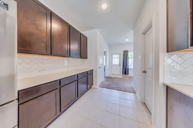 a view of a room with a flat screen tv