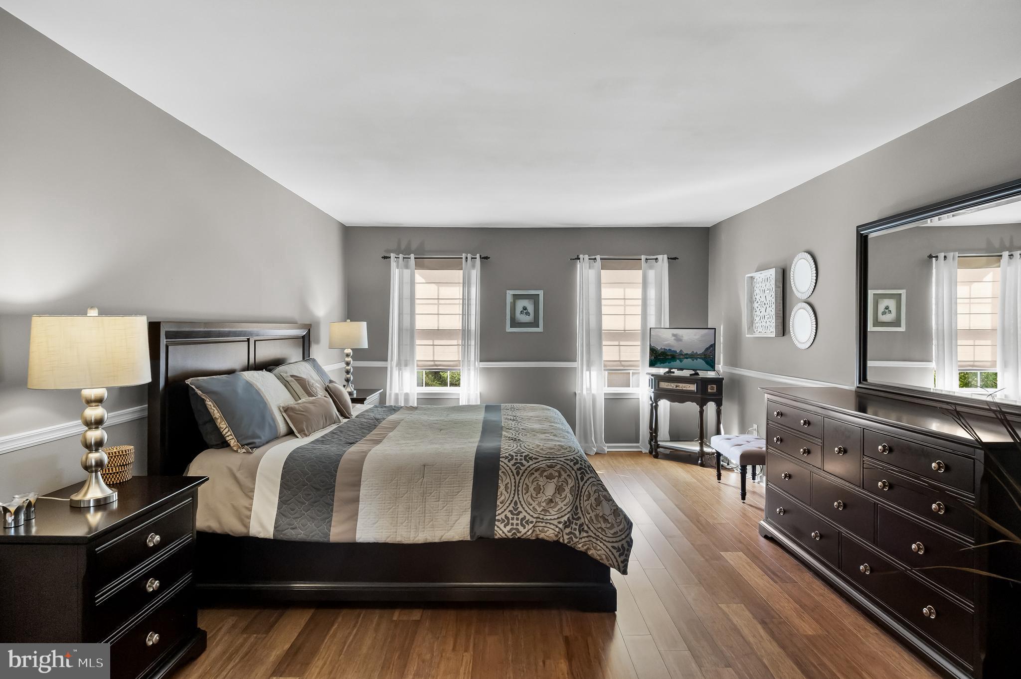 52 Flemish Way Lumberton, NJ 08048 - Photo 20 of 36 a bedroom with a bed a mirror and furniture