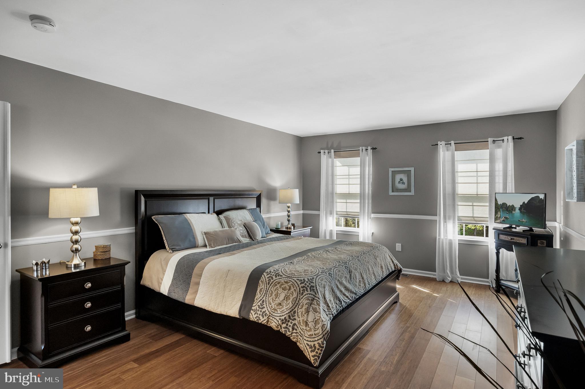 52 Flemish Way Lumberton, NJ 08048 - Photo 21 of 36 a bedroom with a bed and wooden floor