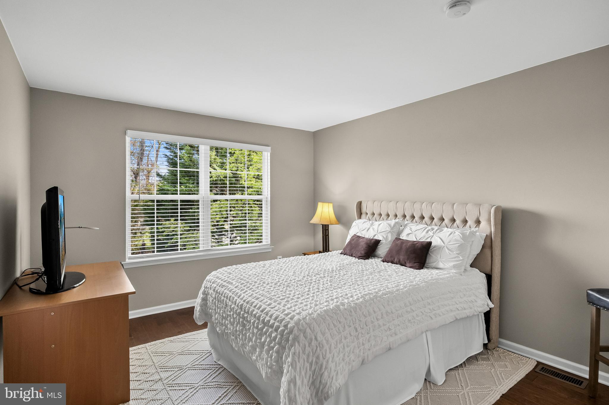 52 Flemish Way Lumberton, NJ 08048 - Photo 27 of 36 a bedroom with a large bed and a flat tv screen on a dresser