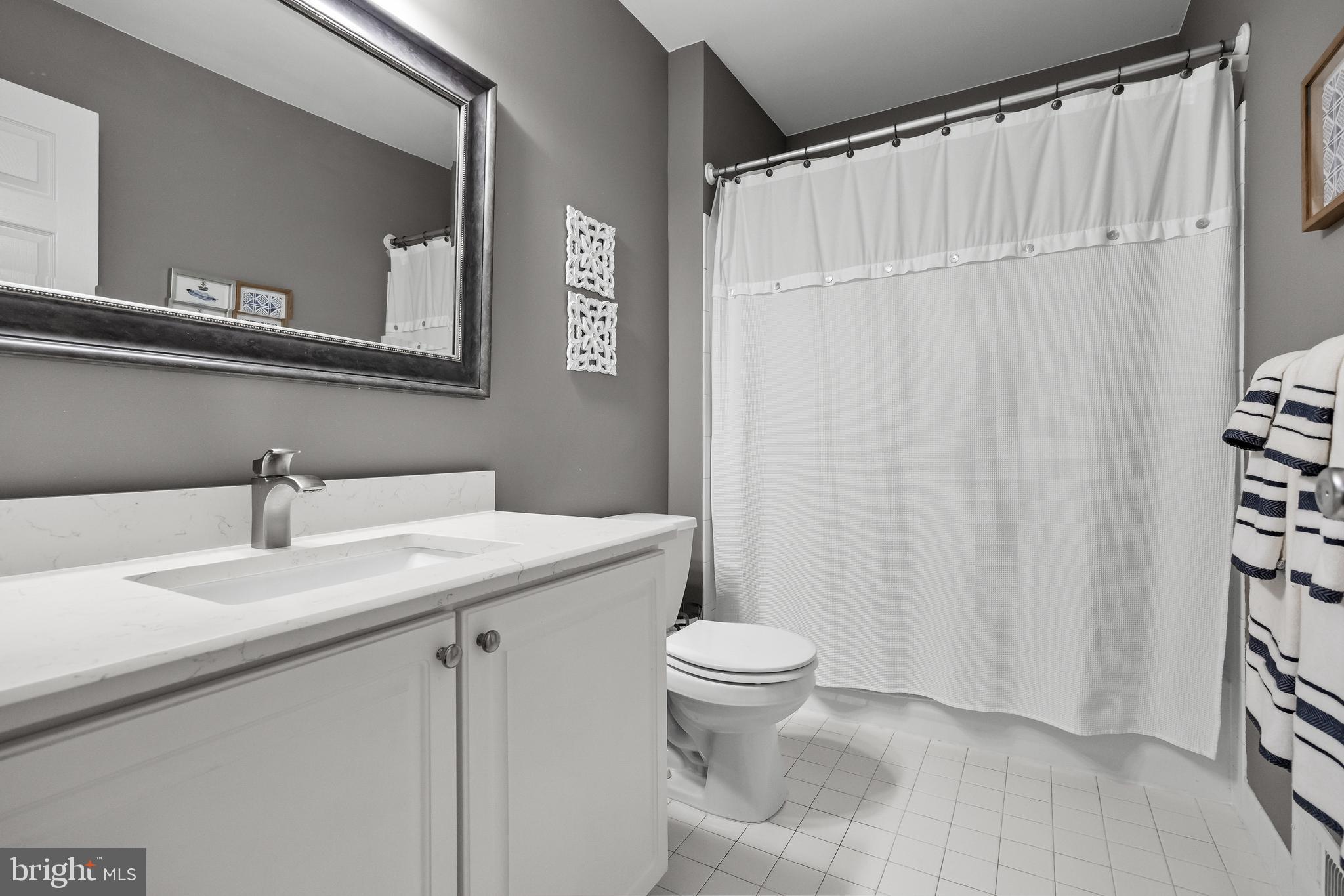 52 Flemish Way Lumberton, NJ 08048 - Photo 29 of 36 a bathroom with a sink a toilet and shower