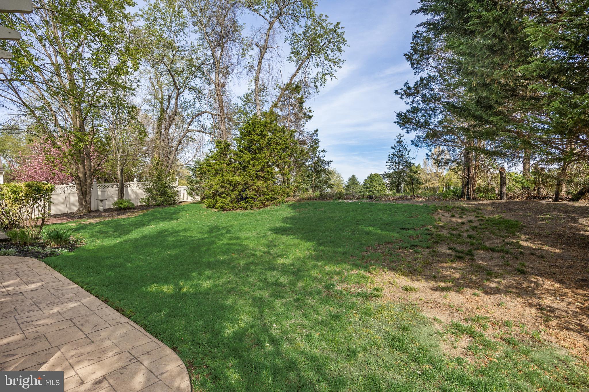 52 Flemish Way Lumberton, NJ 08048 - Photo 35 of 36 a backyard of a house with lots of green space and fountain