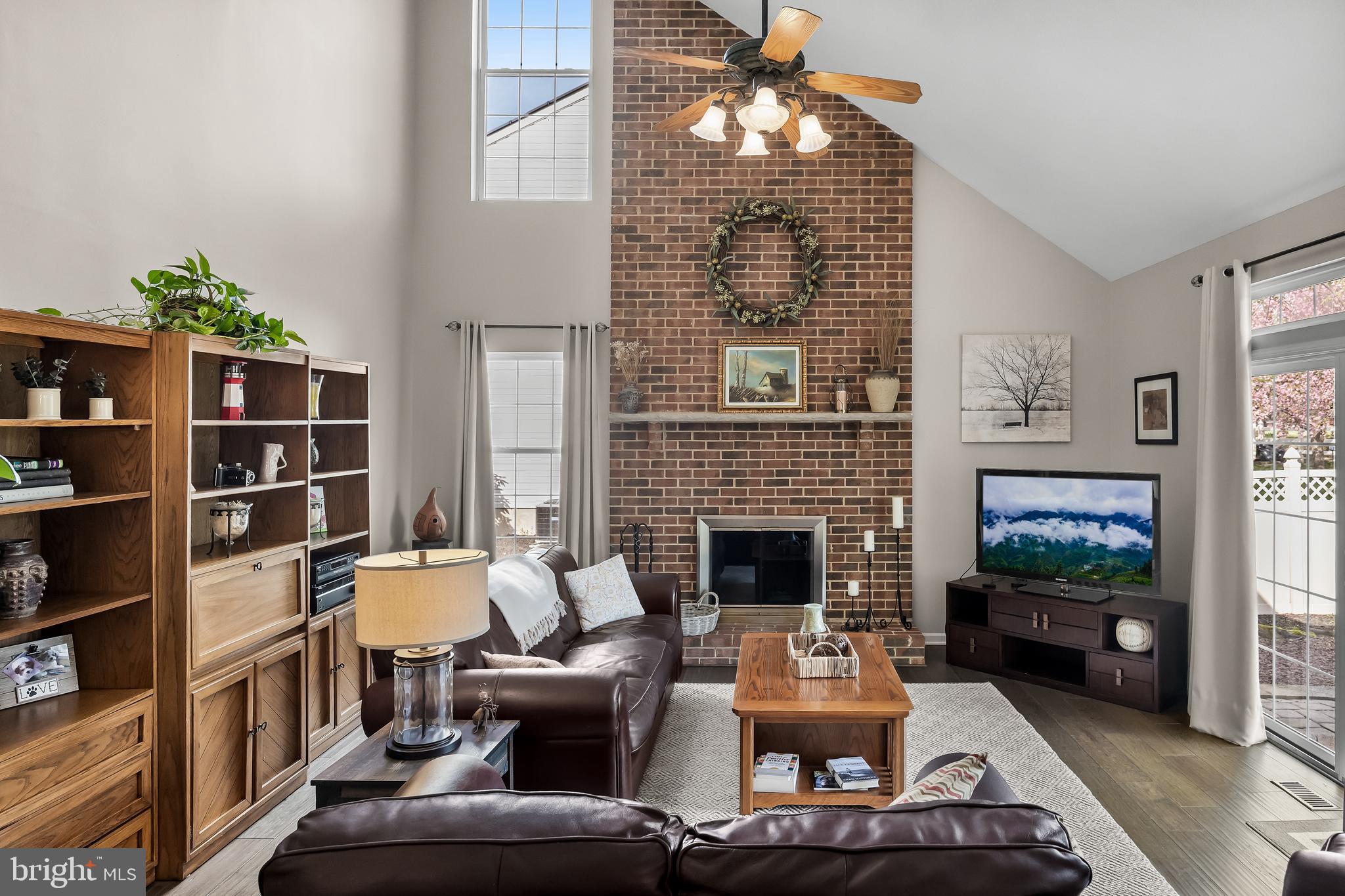 52 Flemish Way Lumberton, NJ 08048 - Photo 5 of 36 a living room with furniture a bookshelf and a fireplace