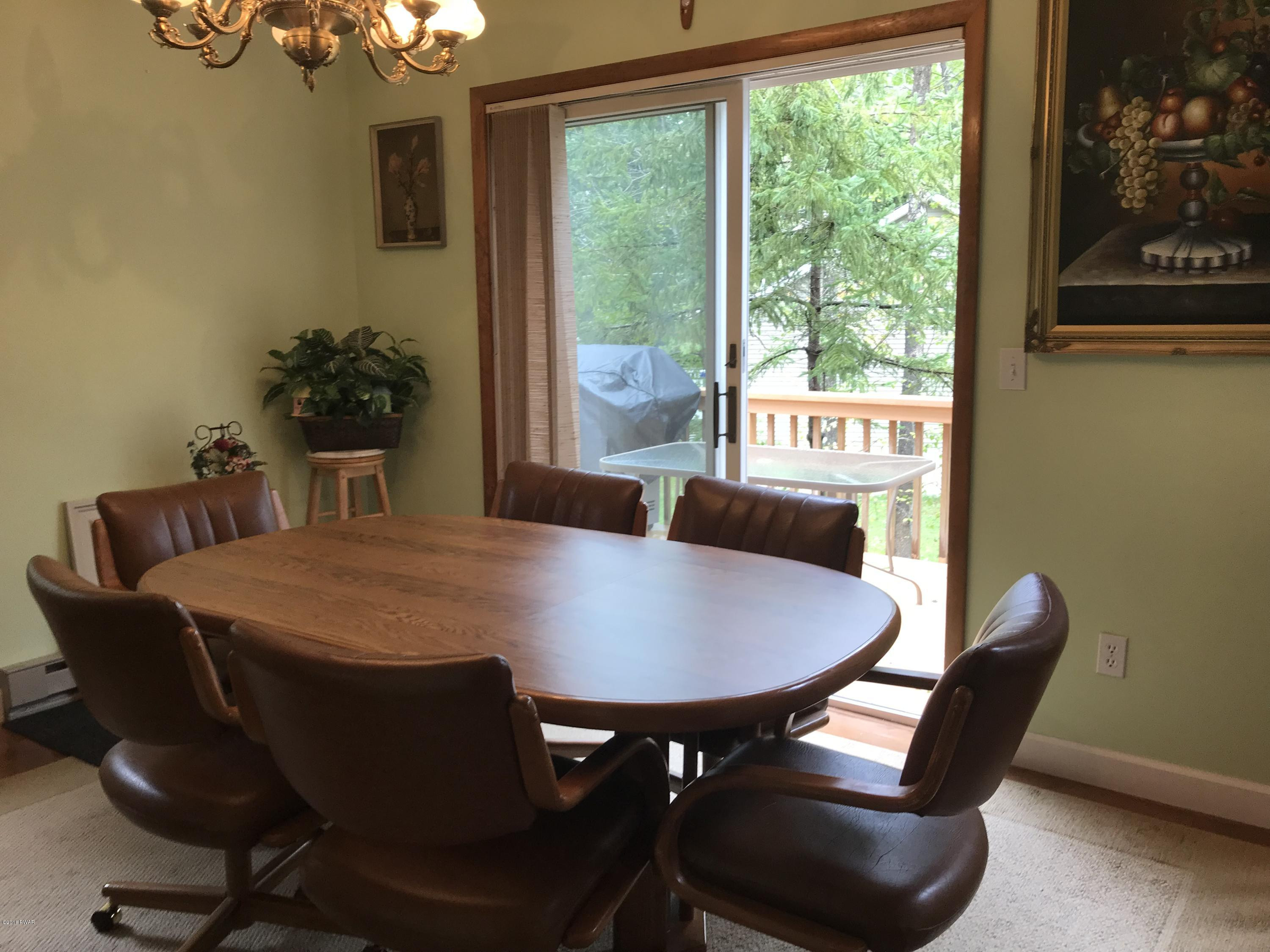 123 Stonehenge Road Milford, PA 18337 - Photo 9 of 25 a dining room with furniture and window