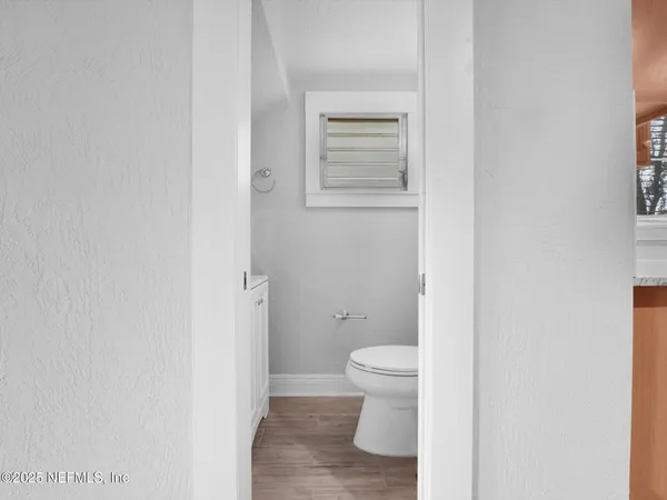 a view of a kitchen with a sink and a stove
