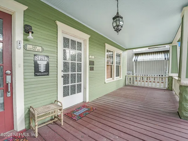 a view of a deck with wooden floor and a yard