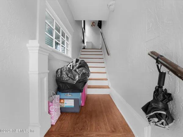 a view of entryway with wooden floor