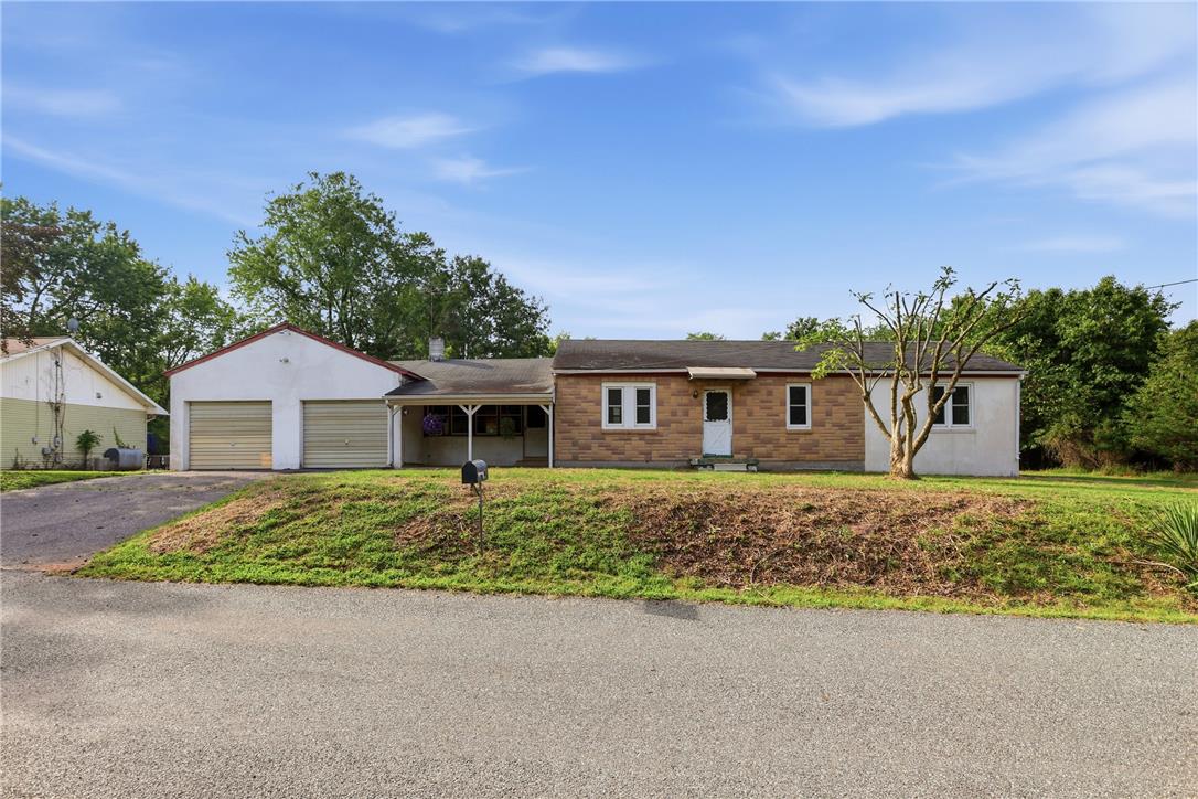 1033 Walt Road Pennsburg, PA 18073 - Photo 1 of 40 A classic ranch home features an attached garage and a covered front porch entryway.
