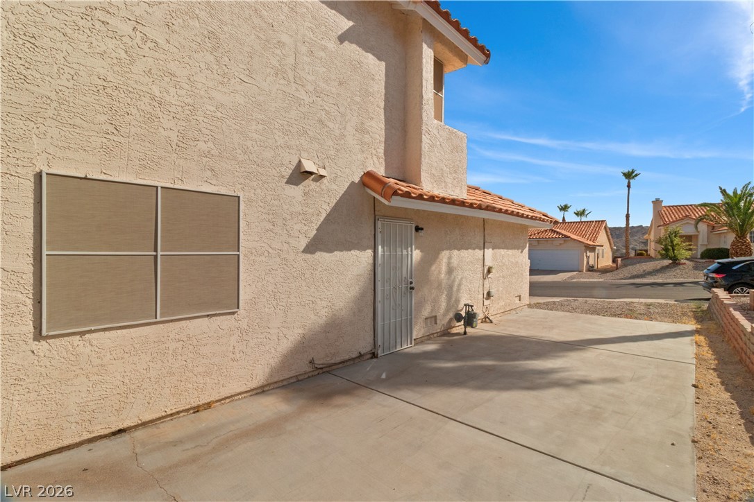3156 Terrace View Drive Laughlin, NV 89029 - Photo 57 of 94 A terracotta tile roof accents this stucco home, offering a glimpse of the neighborhood's arid landscape.