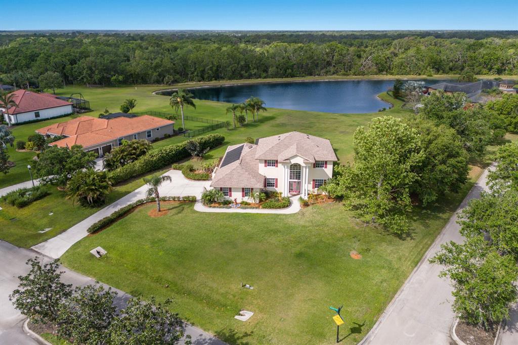 an aerial view of a house with outdoor space