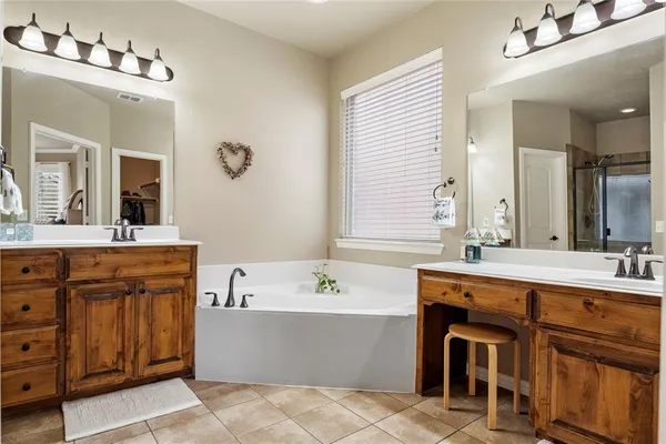 a bedroom with a bed and a ceiling fan