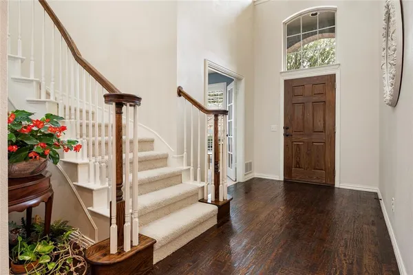 a view of entryway with wooden floor