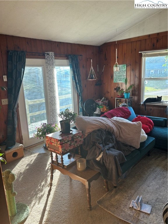 328 Clint Lewis Road Boone, NC 28607 - Photo 15 of 25 a bedroom with a bed table chair and a window