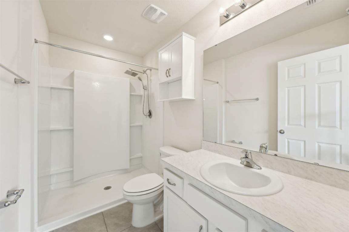 86440 Shortline Circle Yulee, FL 32097 - Photo 27 of 50 a bathroom with a sink toilet mirror and shower