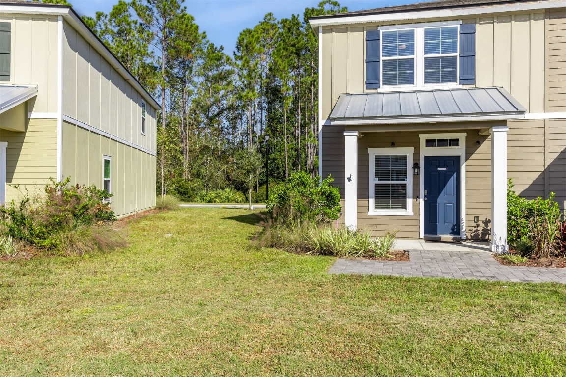 86440 Shortline Circle Yulee, FL 32097 - Photo 3 of 50 a view of a house with plants and garden