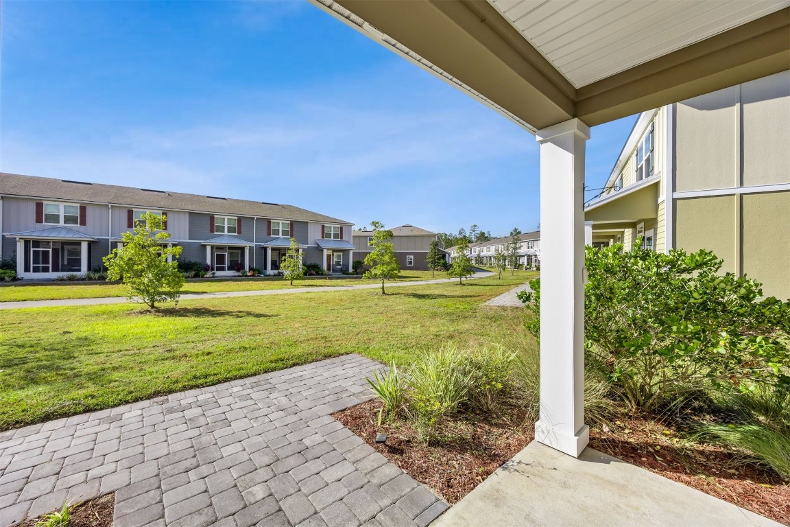 86440 Shortline Circle Yulee, FL 32097 - Photo 6 of 50 a view of a house with a big yard and potted plants