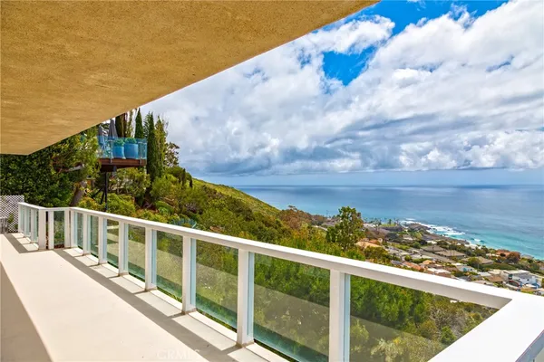 a view of a balcony with an ocean view