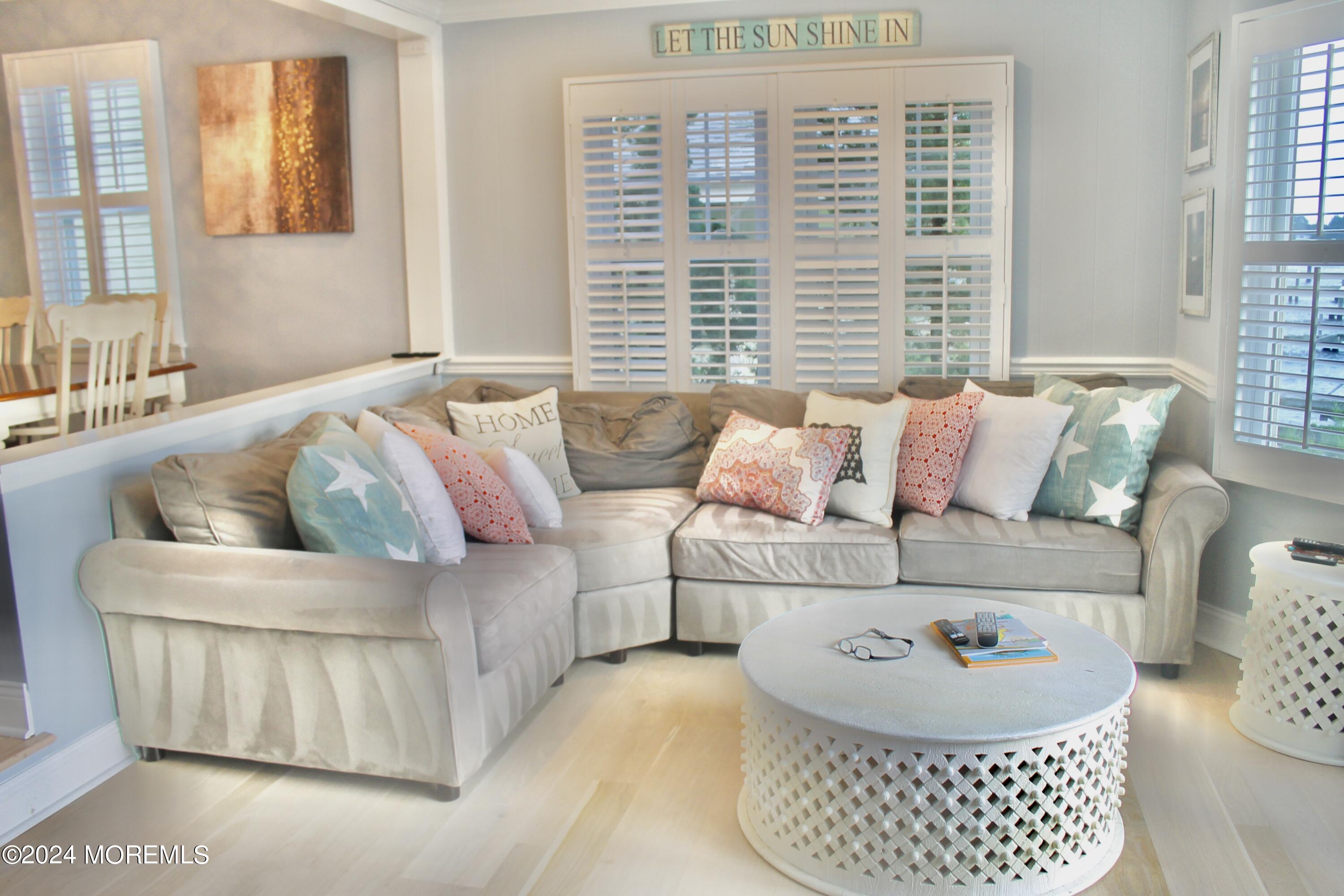 4 Riverview Place Sea Bright, NJ 07760 - Photo 12 of 17 a living room with furniture and a large window