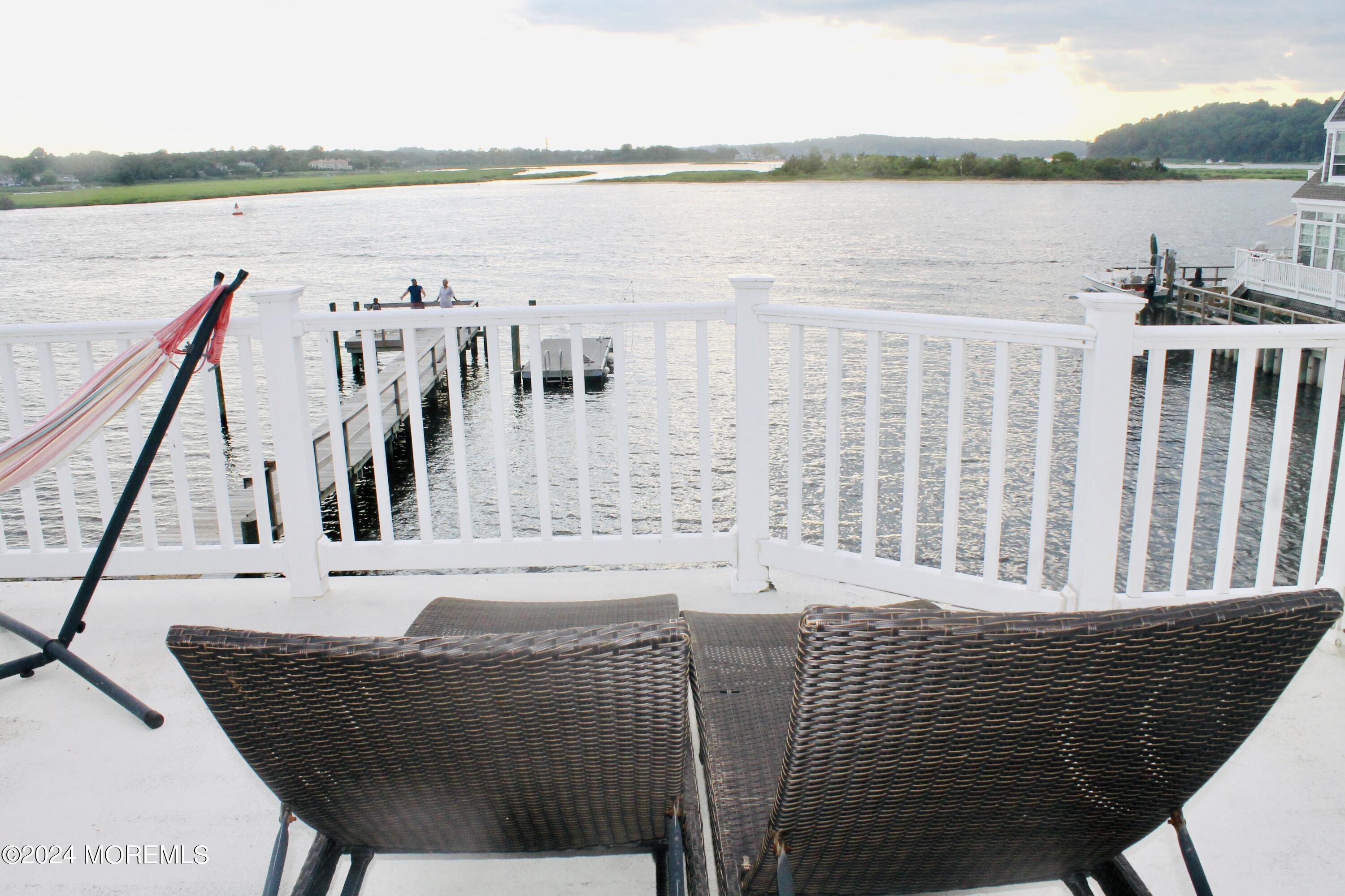 4 Riverview Place Sea Bright, NJ 07760 - Photo 14 of 17 a view of a roof deck with wooden floor and lake view