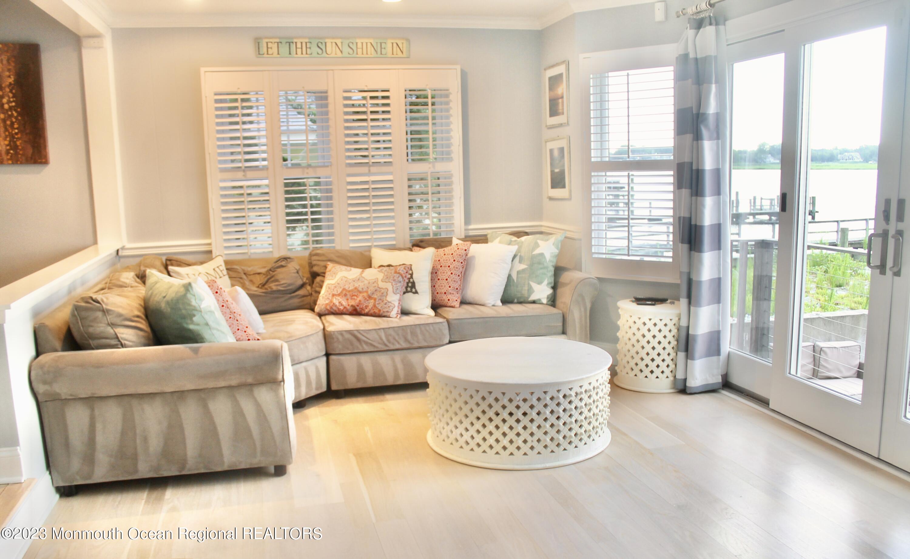 4 Riverview Place Sea Bright, NJ 07760 - Photo 6 of 17 a living room with furniture and a large window