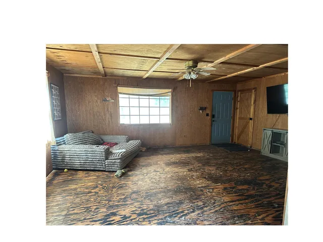 a living room with a couch and a flat screen tv